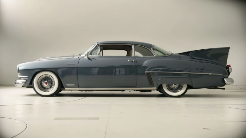1950s American vintage luxury car with fins, fancy rims and chrome by General Motors.png